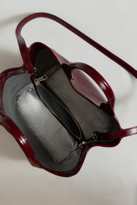 Zilla Leather Cube Bag in Burgundy Napalk leather, with removeable strap for use as a crossbody bag, and a center zipper closure