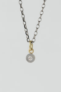 Rene Escobar small circle Valery pendant in sterling silver with a single ethically sourced white diamond and solid gold bale