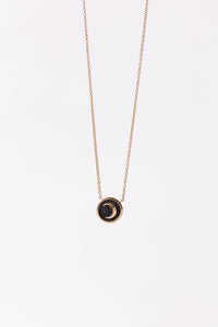 Miles McNeel 14k gold small circular celestial crescent moon necklace with blackened concrete