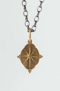 Erica Molinari Ornate 14k Yellow Gold north star charm, double sided with star symbol embossed on front, and cardinal compass directions (n/s/e/w) on the back