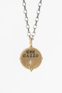 Erica Molinari round 14k gold and white diamond pendant featuring the north star on the front, and "che cazzo" engraving on the back