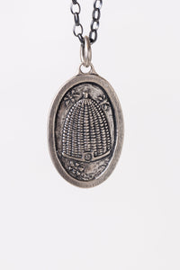 Large oversized Erica Molinari sterling silver, dual-sided, statement charm with a beehive and white diamond on the front and engraving of a rose on the back